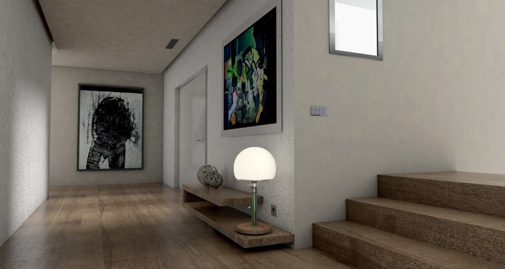 Pasillo moderno y optimizado tras reformas integrales en Barcelona: diseño de interiores con suelo de madera y decoración contemporánea